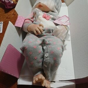 Cute Baby Doll in Gray and Pink Outfit